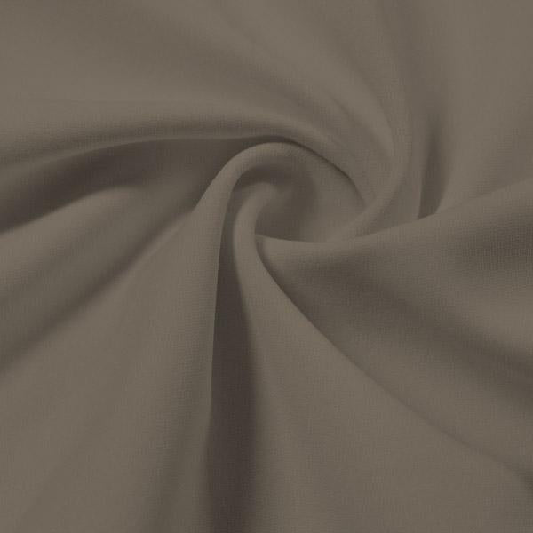 A swirled piece of Synergy Polyester Lycra in the color White