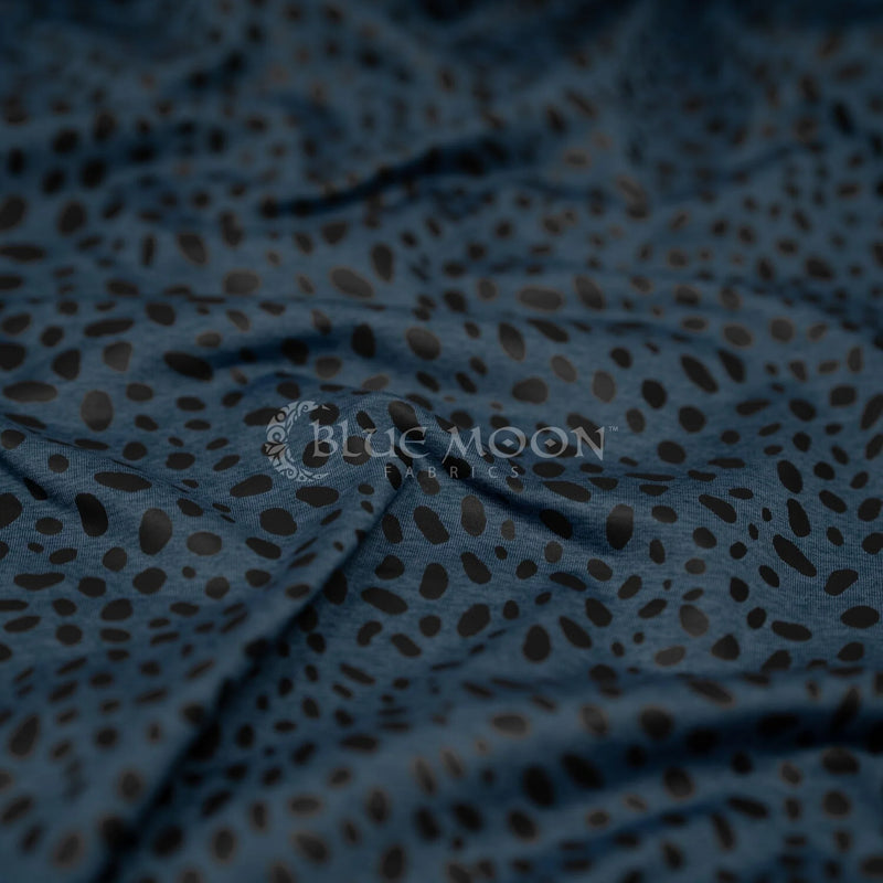 Detailed shot of Abstract Animal Foil Printed Spandex in color Poseidon/Matte Black.