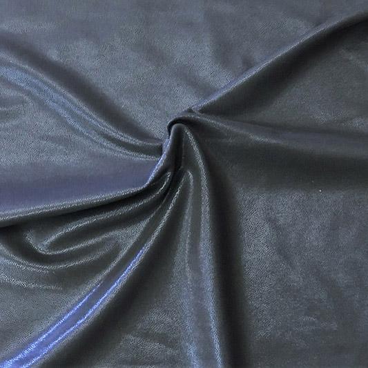 A swirled piece of Mystique foiled microflex spandex with pearl foil on a gunmetal base.