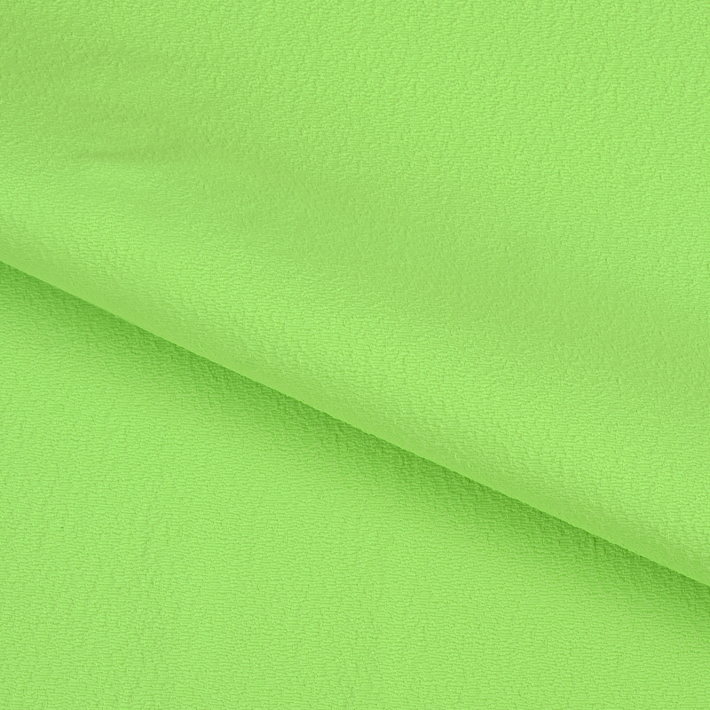 A textured piece of Scrunch Textured Recycled Nylon Spandex Fabric in color Electric Lime.