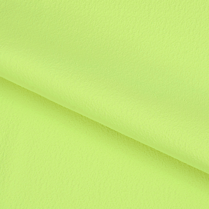 A textured piece of Scrunch Textured Recycled Nylon Spandex Fabric in color lemonade.