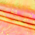 A foiled sample of Tie Dye Thunder Hologram Spandex Fabric in color orange/hot pink/gold.