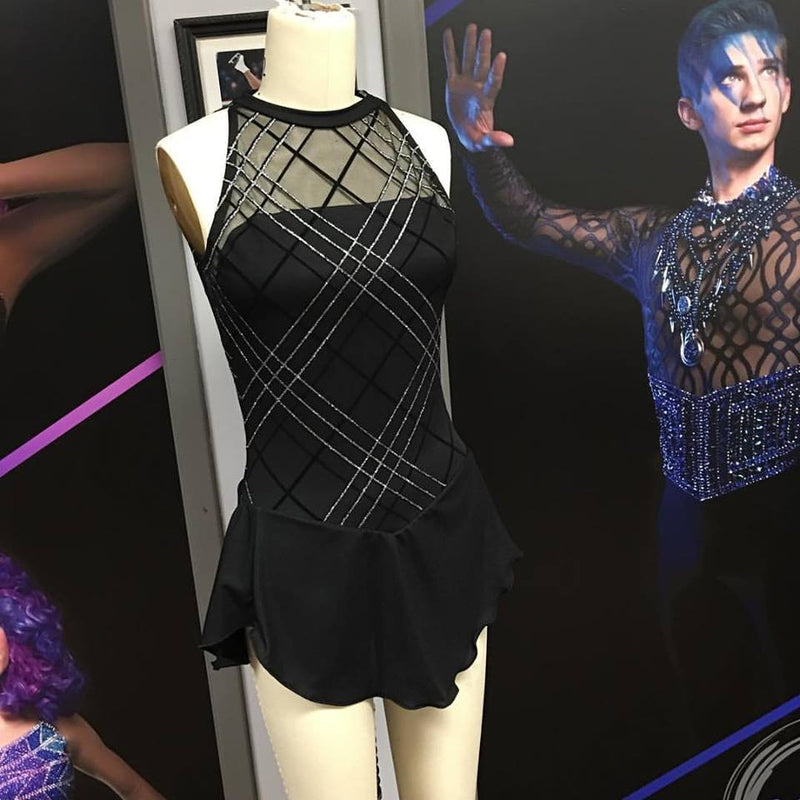 A performance design made of mary jane glitter stretch mesh in the color black-silver.