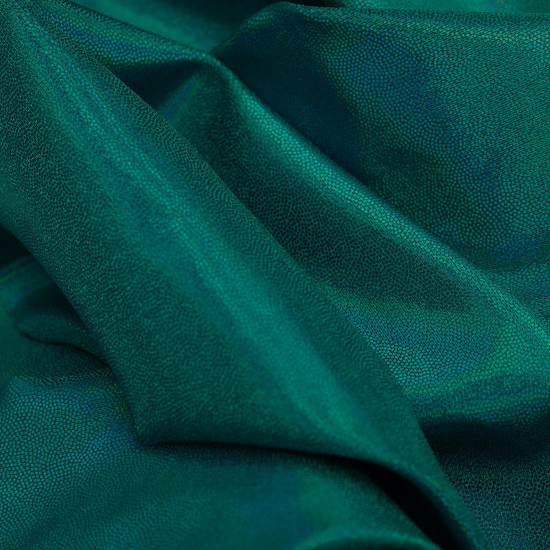 A swirled sample of Sparkles Foiled Spandex in the colorway Black/Turquoise