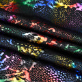 A folded sample of Metallic Reef Hologram Spandex Fabric in the color Black/Multi