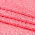 A sample of Robins Egg Speckle Spandex Fabric in the color coral pink