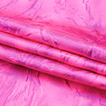 A folded sample of Thunder Hologram Spandex Fabric in the color Hot Pink/Fuchsia