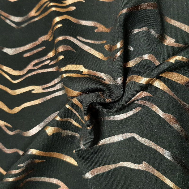 A sample of Recycled EcoTechFlex Zebra Foiled Spandex Fabric in the color Chocolate Gold