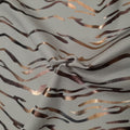 A sample of Recycled EcoTechFlex Zebra Foiled Spandex Fabric in the color Cream/Gold