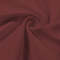 A swirled piece of Synergy Polyester Lycra in the color Picante
