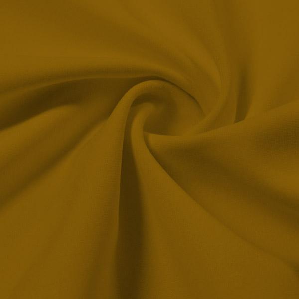 A swirled piece of Synergy Polyester Lycra in the color  Honey