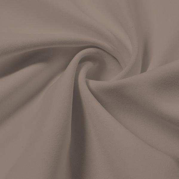 A swirled piece of Synergy Polyester Lycra in the color Taupe