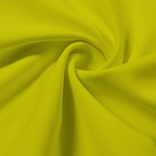 A swirled piece of Synergy Polyester Lycra in the color Margarita