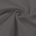 A swirled piece of Synergy Polyester Lycra in the color Gray