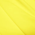 A flat sample of polyester lycra fabric in the color citron.