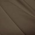 A flat sample of polyester lycra fabric in the color dust.