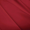 A flat sample of polyester lycra fabric in the color EBI Burgundy.