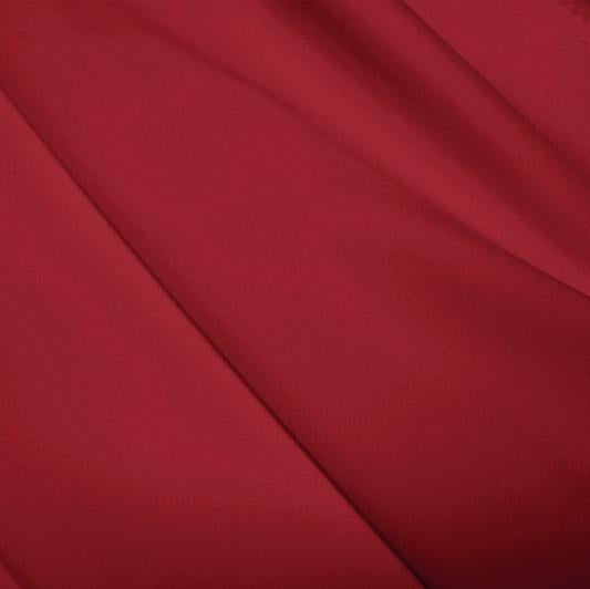 A flat sample of polyester lycra fabric in the color EBI Burgundy.