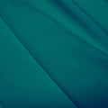 A flat sample of polyester lycra fabric in the color teal green.