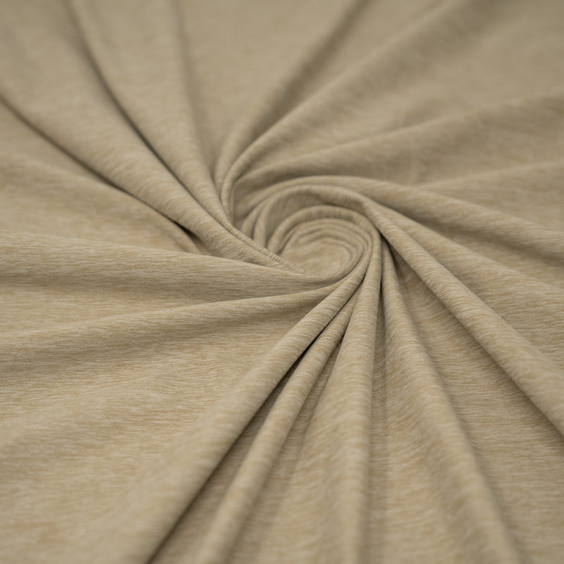 A swirled sample of EcoDelish Double Peached Melange recycled polyester spandex fabric in the color Taupe