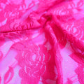 A swirled sample of Ada Stretch Lace in the color fluorescent pink.