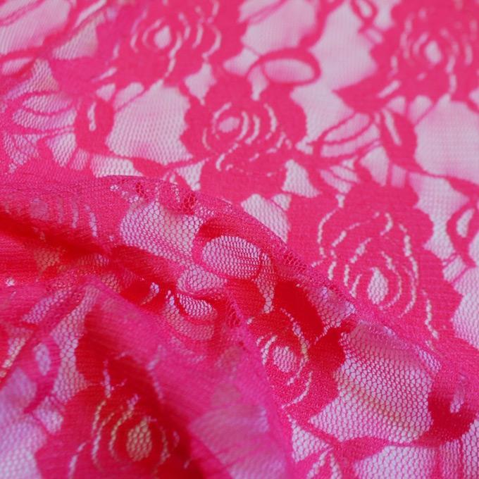 A swirled sample of Ada Stretch Lace in the color hot pink.