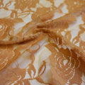 A swirled sample of Ada Stretch Lace in the color nude.