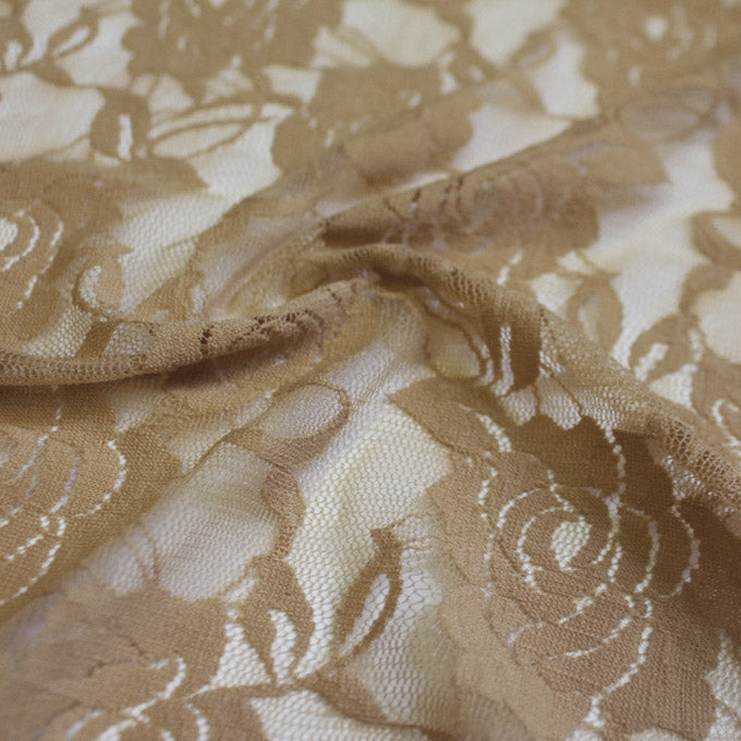 A swirled sample of Ada Stretch Lace in the color Taupe.