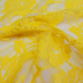 A swirled sample of Ada Stretch Lace in the color yellow.