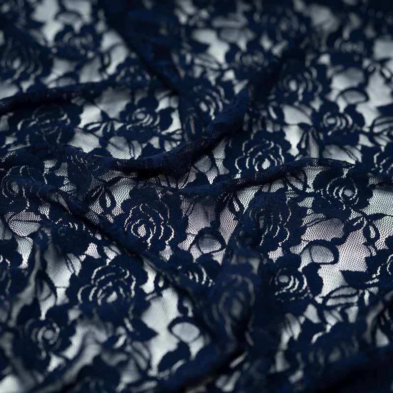 A swirled sample of Ada Stretch Lace in the color Dark Navy.