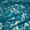 A swirled sample of Ada Stretch Lace in the color Dark Teal.