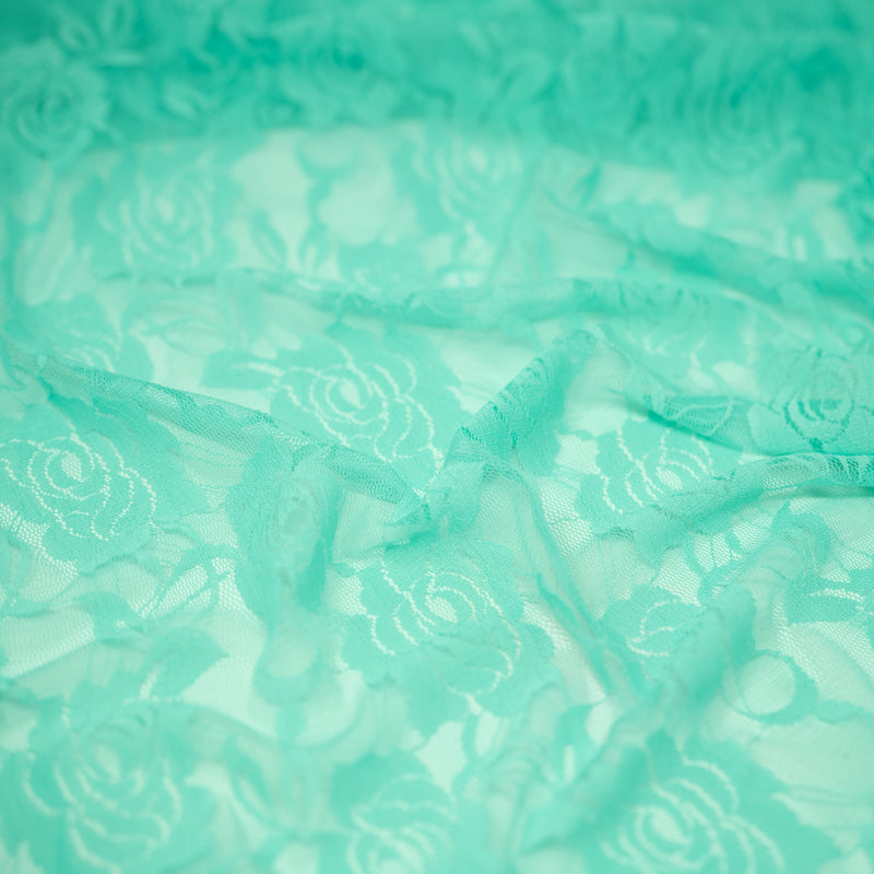 A swirled sample of Ada Stretch Lace in the color Mint.