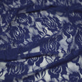 A swirled sample of Ada Stretch Lace in the color Navy.
