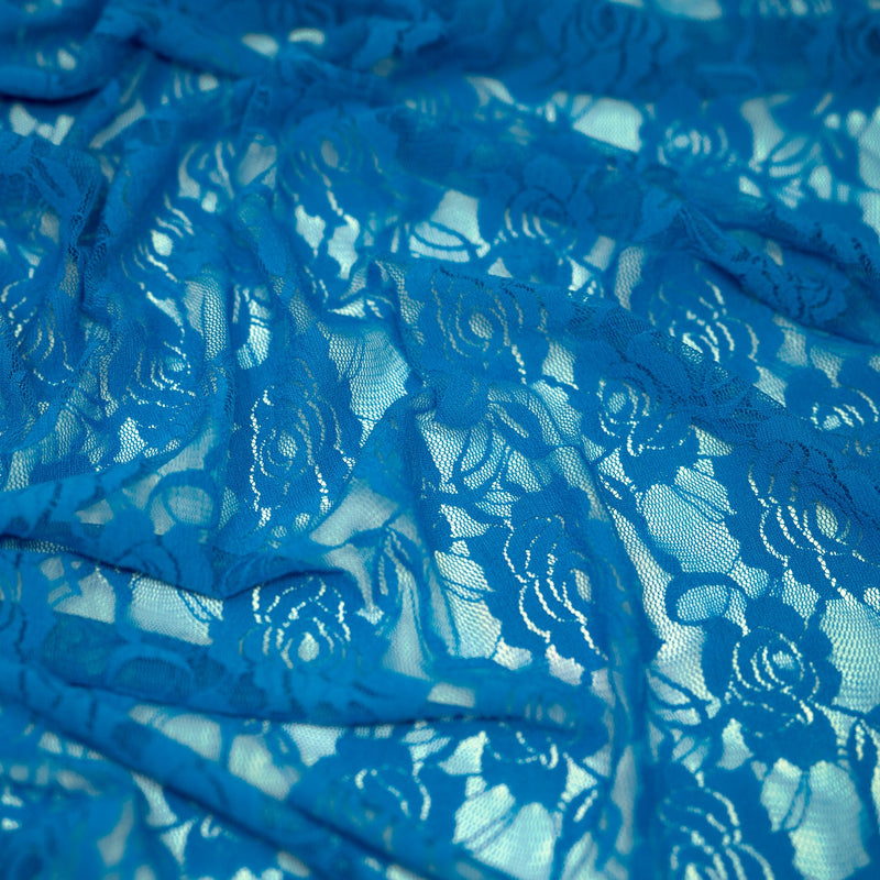 A swirled sample of Ada Stretch Lace in the color Teal.