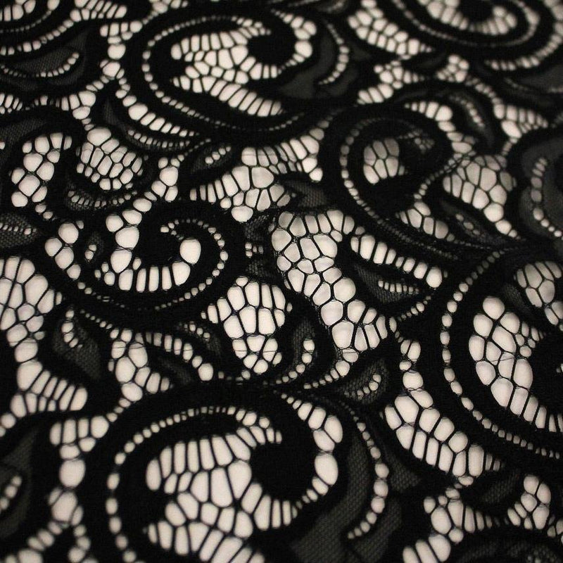 A flat sample of Adelaide stretch lace in the color black.