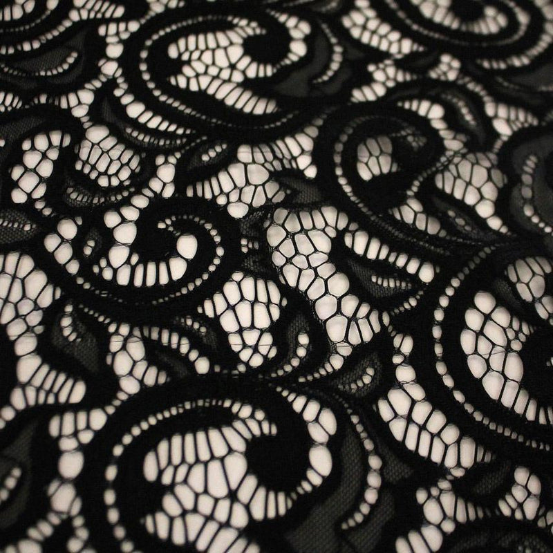 A flat sample of Adelaide stretch lace in the color black.