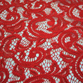 A flat sample of Adelaide stretch lace in the color red.