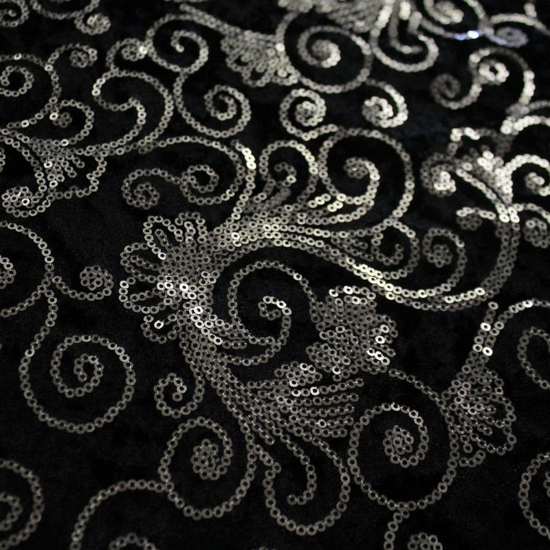 A flat sample of aria stretch velvet seuin in the color black-silver.