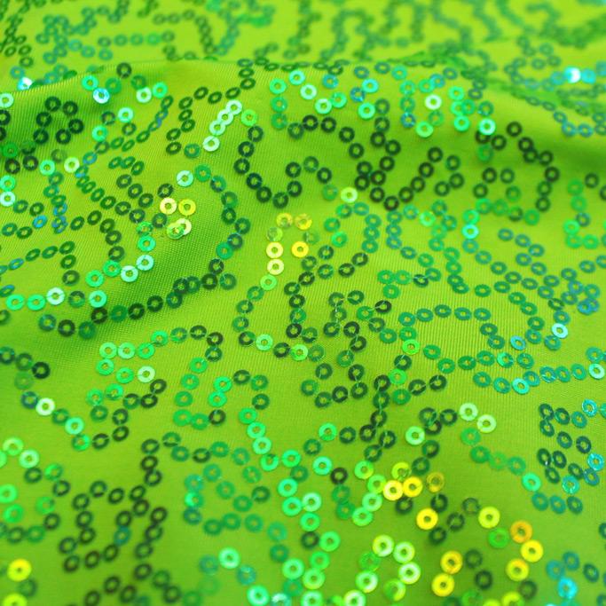 A swirled sample of arriba sequin spandex in the color lime.