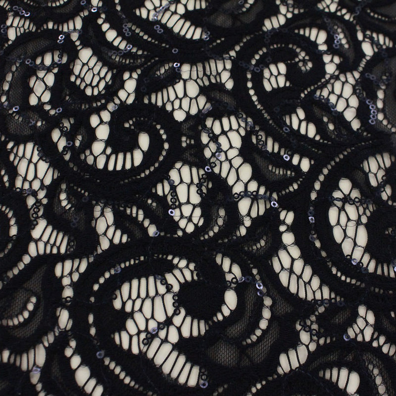 A flat sample of ashlet stretch lace sequin in the color navy.