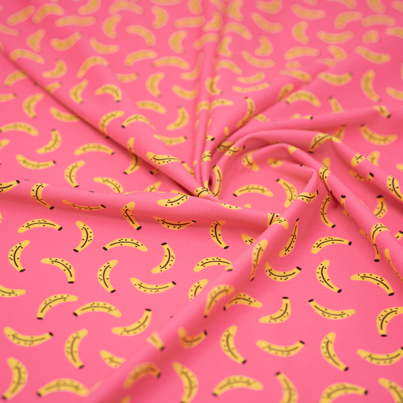 Swirled piece of Bananas on Pink Printed Spandex Fabric