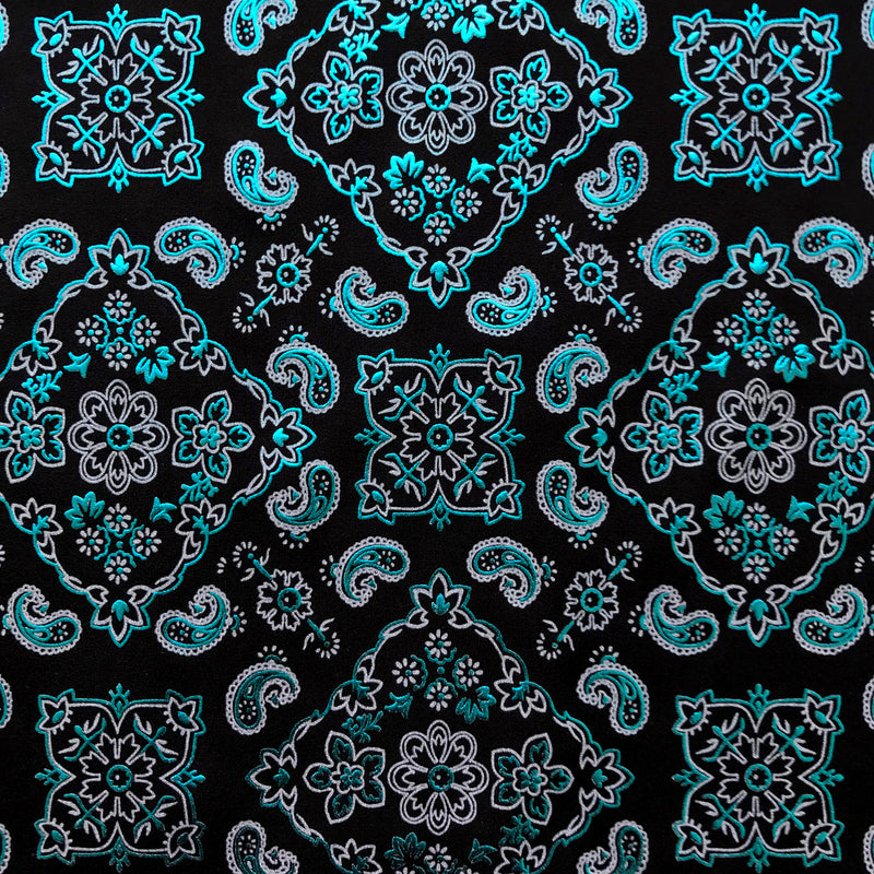 A flat sample of bandana foil printed spandex in the color black-turquoise.