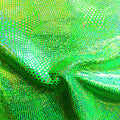 A swirled piece of Beach Ball Foiled Spandex in the color lime.