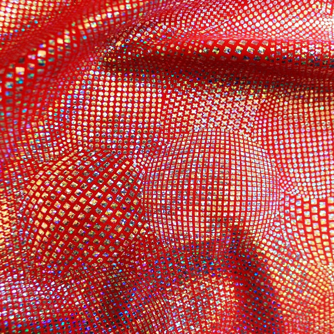 A swirled piece of Beach Ball Foiled Spandex in the color red.