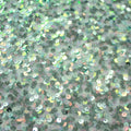 A flat sample of Belle stretch mesh sequin in the color mint.
