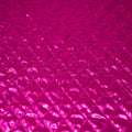 Detailed shot of Betty Embossed Metallic Polyester in Fuchsia.