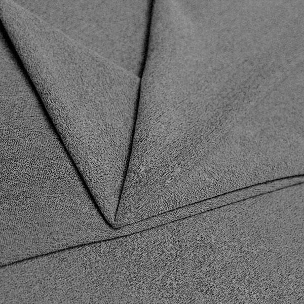 A folded piece of Blast Textured Spandex in stone.