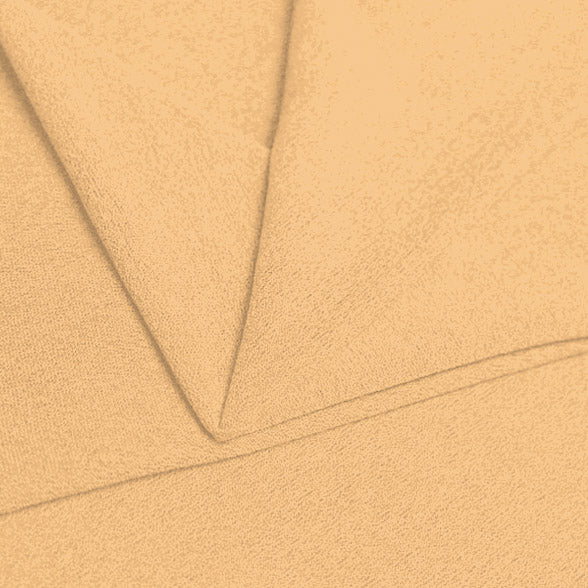 A folded piece of Blast Textured Spandex in Soft Apricot