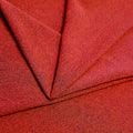 A folded piece of Blast Textured Spandex in Solar Orange