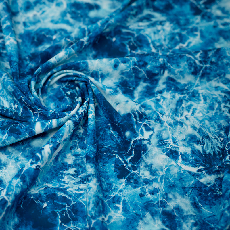 Swirled piece of Blue Magic Marble Printed Spandex